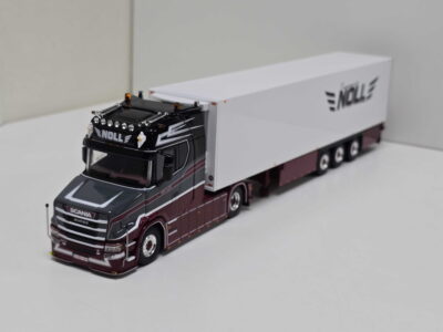 Model Scania semi-truck with maroon cab and long white trailer bearing NOLL branding.