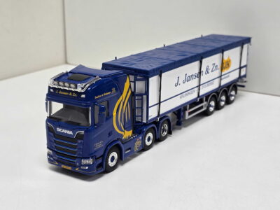 Blue model Scania truck with a white trailer labeled J. Jansen & Zn, photographed on a white surface.