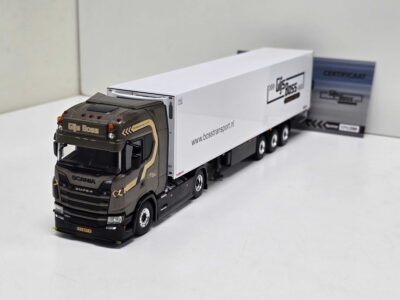 Scale model of a brown Scania truck with a long white trailer on a white surface, logo reading Gijs Boss visible on the cab and trailer.